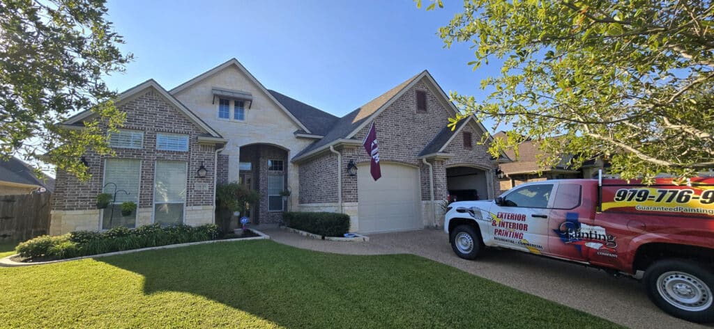 Guaranteed Painting Company truck parked in drive way of Texas home