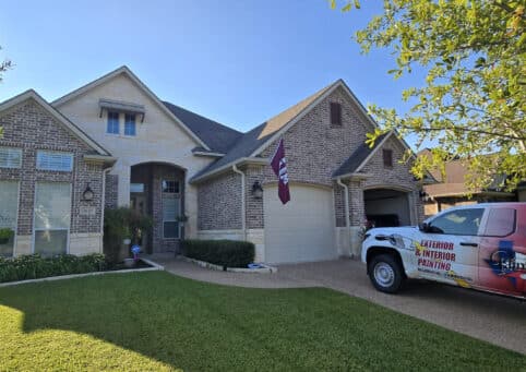 Guaranteed Painting Company truck parked in drive way of Texas home