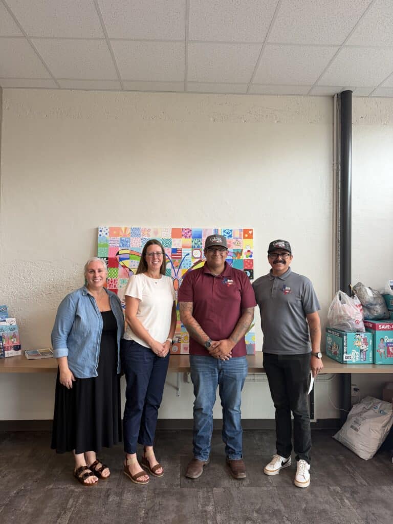 Guaranteed Painting Company representatives with Voices for Children, CASA staff during check presentation