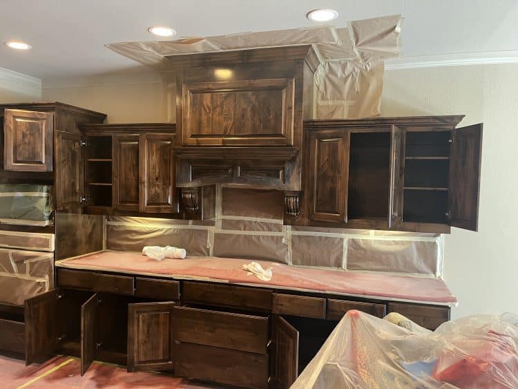 Kitchen cabinets being restained in Texas home