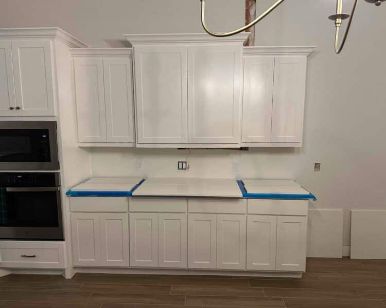 Painted white cabinet walls and paint prep